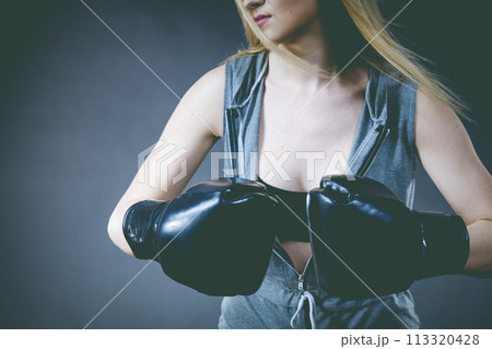 Boxer girl exercise with boxing gloves. 113320428