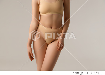 Fit and healthy. Beautiful female body on white 113322436