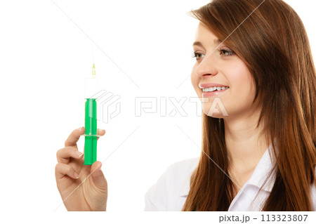 Medical. Woman doctor in lab coat with syringe 113323807