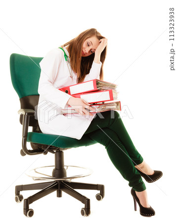 Paperwork. Overworked doctor woman with documents 113323938