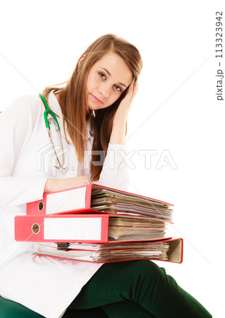 Paperwork. Overworked doctor woman with documents 113323942