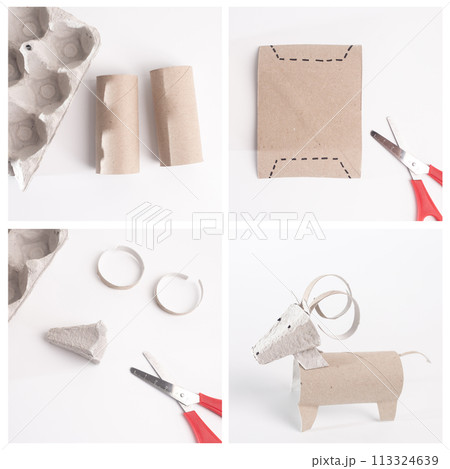 Simple surface displays a creative ram with curled horns crafted from a recycled toilet paper roll, an easy and educational animal-themed project 113324639