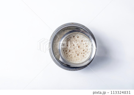 South Indian Filter coffee served on a white background South Indian Filter coffee served on a white background 113324831