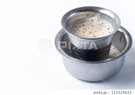 South Indian Filter coffee served on a white background. Closeup 113324832