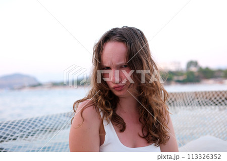 Her face is a portrait of dissatisfaction and boredom she's fed up and it shows. High quality photo 113326352