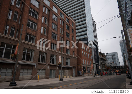 typical New York street with red brick building and skyscrapers 113328890