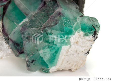macro mineral fluorite stone on white background macro mineral fluorite stone on white background 113330223