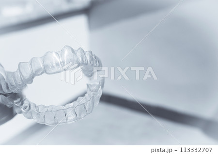 Invisible teeth aligner on light background 113332707