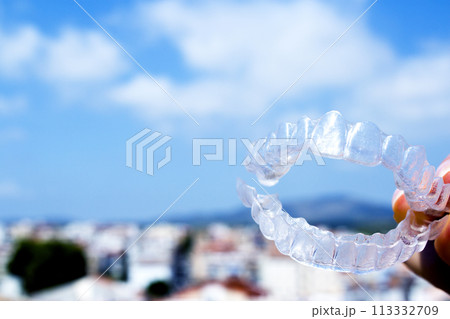 Invisible teeth aligner on light background 113332709
