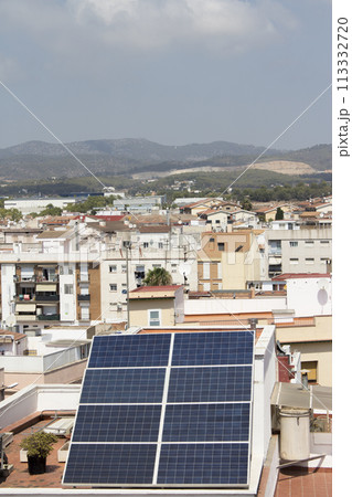 Solar panels placed on the roof of a building Solar panels placed on the roof of a building 113332720