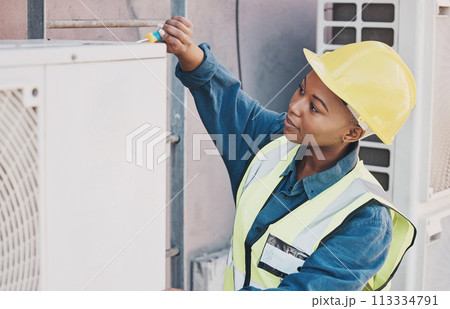Black woman, technician and building installation for solar panel, construction or vent on roof. African female person, contractor or engineer installing industrial equipment for architecture in city Black woman, technician and building installation for solar panel, construction or vent on roof. African female person, contractor or engineer installing industrial equipment for architecture in city 113334791