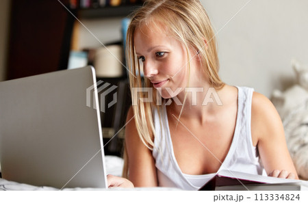 College, remote work and student with laptop in home or bedroom with online class, elearning or research. University, project and woman studying with computer, notebook and typing analysis of info 113334824