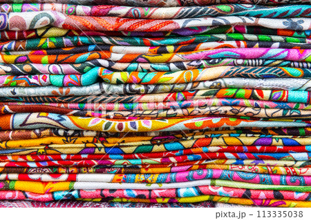 Stacked assortment of colorful fabric for sale Stacked assortment of colorful fabric for sale 113335038