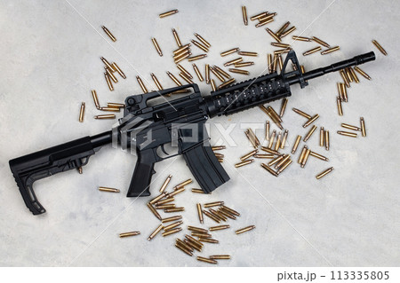 M4 carbine and 5.56mm shells and magazine with bullets M4 carbine and 5.56mm shells and magazine with bullets 113335805