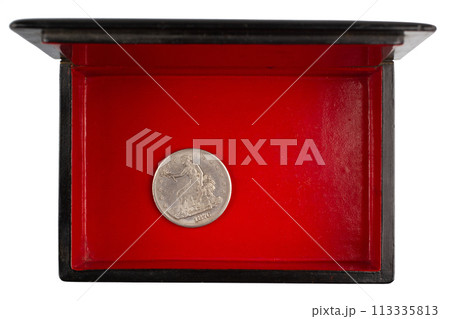 vintage old black and red casket with silver dollar coin 113335813