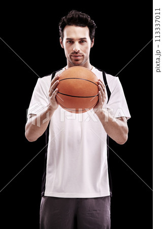 Basketball, portrait and fitness man with ball in studio for training, wellness or exercise challenge on black background. Workout, face and male athlete with handball, catch or performance match 113337011