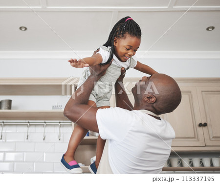 All thats missing is my cape. a man lifting his adorable little daughter in the air. All thats missing is my cape. a man lifting his adorable little daughter in the air. 113337195