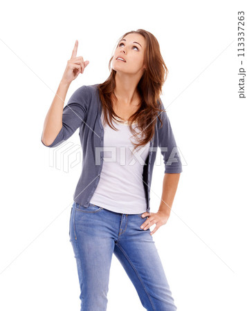 Pointing, looking and young woman in a studio with mockup for marketing, promotion or advertising. View, mock up and female person from Canada with show hand gesture isolated by white background. Pointing, looking and young woman in a studio with mockup for marketing, promotion or advertising. View, mock up and female person from Canada with show hand gesture isolated by white background. 113337263