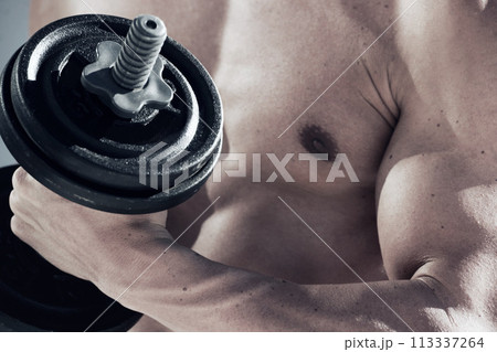 Sports, dumbbell weight and closeup of man with muscles doing workout in gym for bodybuilding training. Fitness, exercise and male person from Canada with equipment for health in wellness center. Sports, dumbbell weight and closeup of man with muscles doing workout in gym for bodybuilding training. Fitness, exercise and male person from Canada with equipment for health in wellness center. 113337264