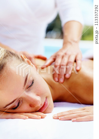 Spa, massage and luxury with woman, relax and health with body care, treatment and vacation. Person, getaway trip and girl on a weekend break, calm and holiday with peace, stress relief and wellness 113337292