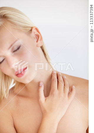 Girl, skincare and touch with eyes closed in studio for wellness, beauty or health by white background. Woman, model and peace with cosmetics for neck, change and transformation for natural glow 113337394