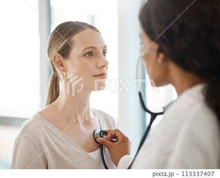 Doctor listening to stethoscope heartbeat, patient breathing and lungs for healthcare checkup, test and consulting in hospital. Woman with medical screening from cardiology physician for tuberculosis Doctor listening to stethoscope heartbeat, patient breathing and lungs for healthcare checkup, test and consulting in hospital. Woman with medical screening from cardiology physician for tuberculosis 113337407