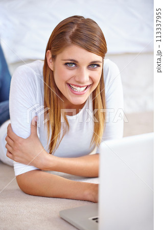 Woman, remote work and portrait with laptop on floor of home to update blog post, social media and digital subscription. Happy freelancer relax with computer for online shopping, email and research 113337955