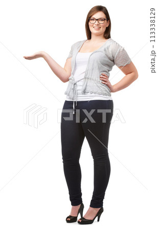 Portrait, presentation and palm with a plus size woman in studio isolated on a white background for offer. Advertising, marketing or information with a happy young person showing space recommendation 113338129