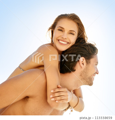 Happy, piggyback and couple at a beach with love, support and bonding on summer break. Travel, smile and people hug in nature with trust, care and having fun with back ride, adventure or date at sea 113338659