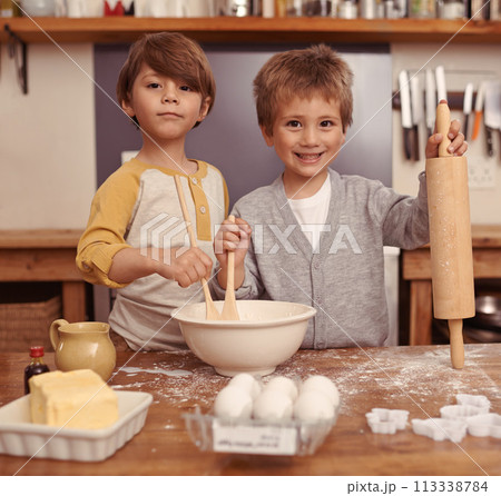 Portrait, smile and brothers in a kitchen, baking and child development with happiness and ingredients. Face, kids and siblings with holiday and weekend break with hobby, home and vacation with joy Portrait, smile and brothers in a kitchen, baking and child development with happiness and ingredients. Face, kids and siblings with holiday and weekend break with hobby, home and vacation with joy 113338784