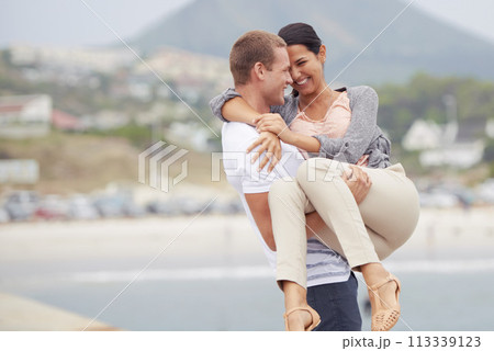Smile, love and man carrying woman in street with support, activity and date on vacation in Mexico. Road, couple and happy with embrace in city for romance, travel and adventure on holiday together 113339123