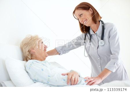 Her patients are important to her - Senior Care. Mature doctor pays her elderly female patient a visit following an operation. 113339174