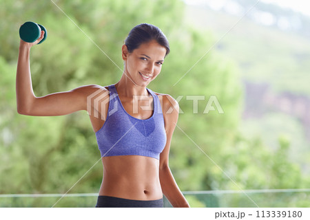 Happy woman, portrait and weightlifting with dumbbells for workout, exercise or muscle gain on balcony. Young female person with smile and small barbell for fitness or outdoor training on terrace Happy woman, portrait and weightlifting with dumbbells for workout, exercise or muscle gain on balcony. Young female person with smile and small barbell for fitness or outdoor training on terrace 113339180