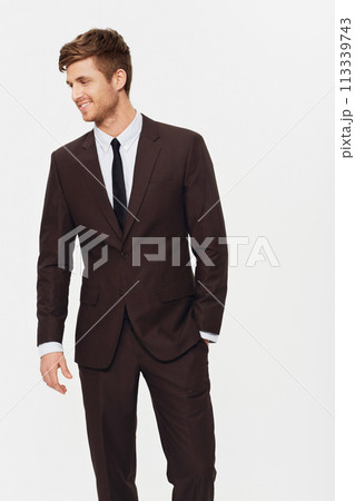 Fashion, suit and business man in studio with classic style, elegance or confidence on white background. Stylish, clothes or fashionable male entrepreneur with cool outfit choice or gentleman apparel 113339743