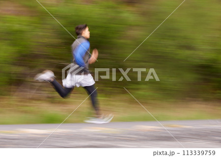 Blur, runner and man running in nature training, cardio exercise and workout for sports or speed. Fast motion, fitness action or healthy athlete on jog in a forest, road or mountain trail outdoors Blur, runner and man running in nature training, cardio exercise and workout for sports or speed. Fast motion, fitness action or healthy athlete on jog in a forest, road or mountain trail outdoors 113339759