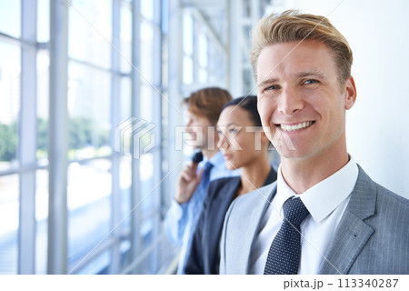 Teamwork, portrait and business people by office window for legal company, management and collaboration. Corporate lawyers, professional attorney and men and woman for partnership, law firm or career 113340287