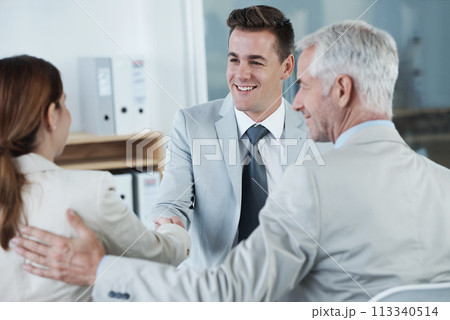 Happy, handshake and hr with candidate in office for business meeting, discussion or recruitment. Smile, hiring and man talking to professional human resources managers in workplace boardroom. Happy, handshake and hr with candidate in office for business meeting, discussion or recruitment. Smile, hiring and man talking to professional human resources managers in workplace boardroom. 113340514