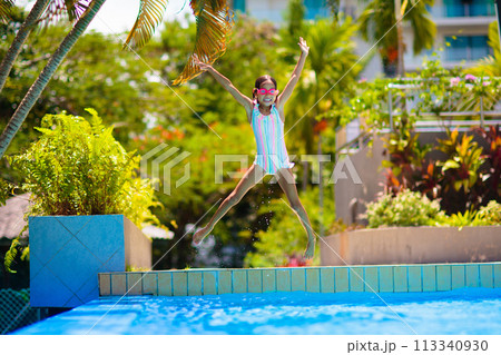 Child in swimming pool on ring toy. Kids swim. Child in swimming pool on ring toy. Kids swim. 113340930