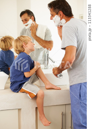 Shaving, father and child with cream on face, smile and bonding in home with morning routine. Teaching, learning and dad with happy son in bathroom for family, clean fun and grooming together. Shaving, father and child with cream on face, smile and bonding in home with morning routine. Teaching, learning and dad with happy son in bathroom for family, clean fun and grooming together. 113341288