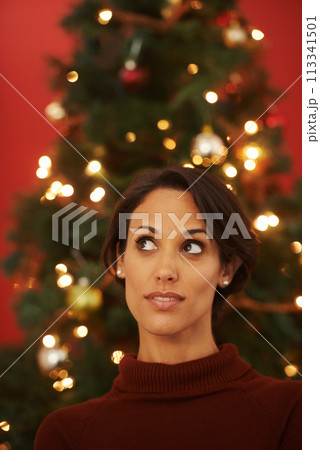 Christmas, tree and woman in home thinking of festive holiday and planning decoration event on vacation. Happy, girl and excited for xmas in winter and ideas for house with traditional aesthetic 113341501