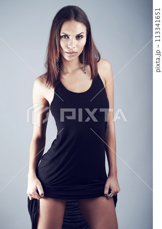 Confident, woman and portrait for fashion in studio on gray background with elegant dress or formal style. Luxury, clothes and model in trendy, fancy and edgy outfit with pride in classic aesthetic 113341651