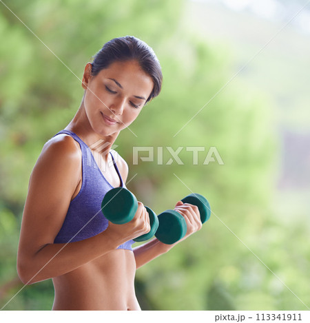 Happy woman, fitness and weightlifting with dumbbells for workout, exercise or muscle gain on balcony. Female person with smile for lifting weight or small barbells for outdoor training on terrace Happy woman, fitness and weightlifting with dumbbells for workout, exercise or muscle gain on balcony. Female person with smile for lifting weight or small barbells for outdoor training on terrace 113341911