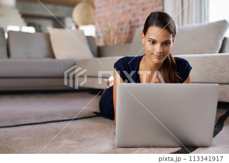 Female student, smile and floor with laptop, home lounge and computer for social media. Technology, happy or relaxed woman in living room, online or internet for connection and communication Female student, smile and floor with laptop, home lounge and computer for social media. Technology, happy or relaxed woman in living room, online or internet for connection and communication 113341917