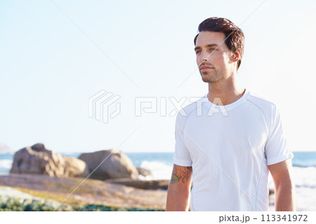 Fitness, thinking and space with man at beach in summer for sports, training or cardio on blue sky. Exercise, vision and health with young runner or athlete by ocean or sea for physical workout Fitness, thinking and space with man at beach in summer for sports, training or cardio on blue sky. Exercise, vision and health with young runner or athlete by ocean or sea for physical workout 113341972