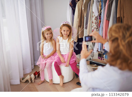 Children, fairy and costume with cellphone picture or social media post for dress up event, connection or memory. Girls, crowns and smile for smartphone photography for online network, fun or bonding Children, fairy and costume with cellphone picture or social media post for dress up event, connection or memory. Girls, crowns and smile for smartphone photography for online network, fun or bonding 113342079