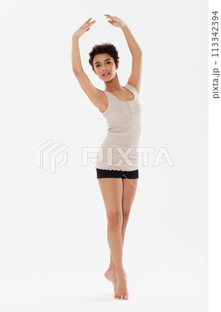 Dance, ballet and portrait of ballerina on a white background for performance, fitness and training. Ballerina, dancer and isolated woman pose for balance, creative routine and practice in studio 113342394