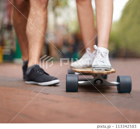 Skateboard, learning and legs of couple of friends teaching partner skills, riding lesson or practice moving. Skate shoes, sneakers and closeup person coaching, help or support balance on ground Skateboard, learning and legs of couple of friends teaching partner skills, riding lesson or practice moving. Skate shoes, sneakers and closeup person coaching, help or support balance on ground 113342583