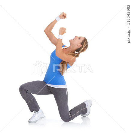 Excited woman, fitness and fist pump in celebration for winning isolated on a white studio background. Female person or athlete smile in relief for prize, achievement or good news on mockup space 113342902
