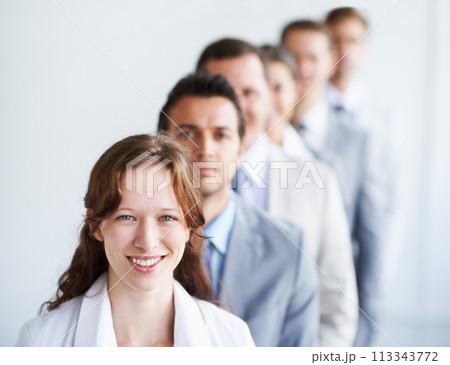 Woman, portrait and leader for team finance career, standing and ready for job interview. Worker, corporate accountant in suit or professional in workplace, colleagues in office and confident 113343772