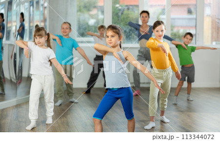 Group of children dancing modern dances Group of children dancing modern dances 113344072